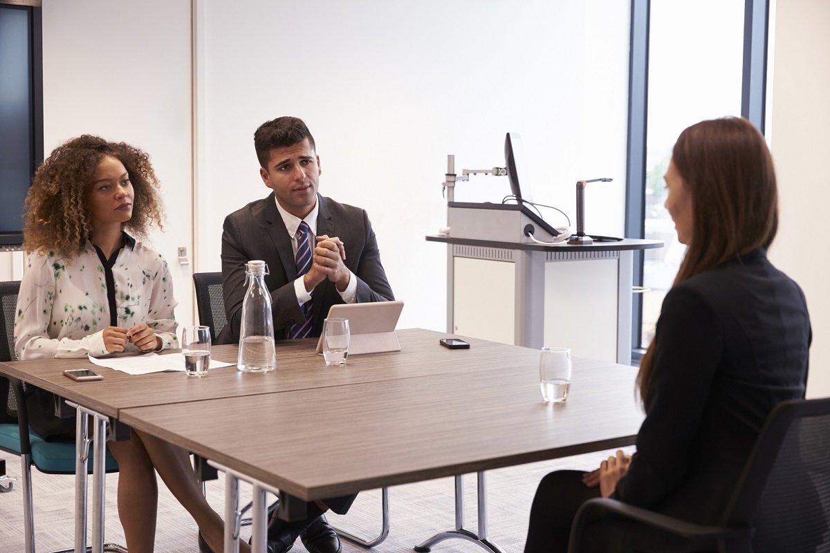 Female Candidate Being Interviewed For Position In Office